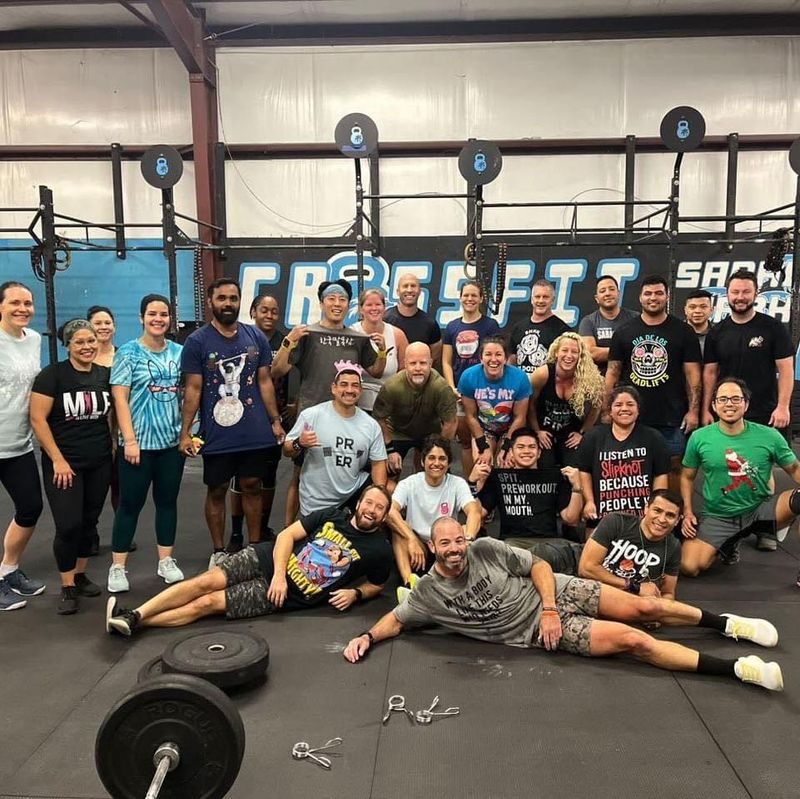 Large group of CrossFit Sabal Park members posing together after a CrossFit Open workout